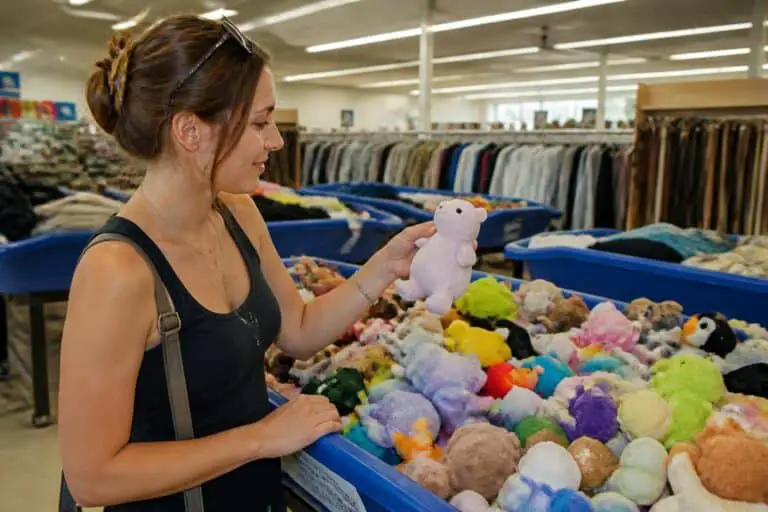 Woman digging through a thrift store bin of small bean filled plush toys